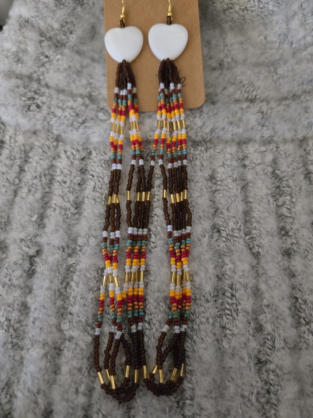 Handcrafted Brown Beaded Tassel Earrings with White Heart Shells